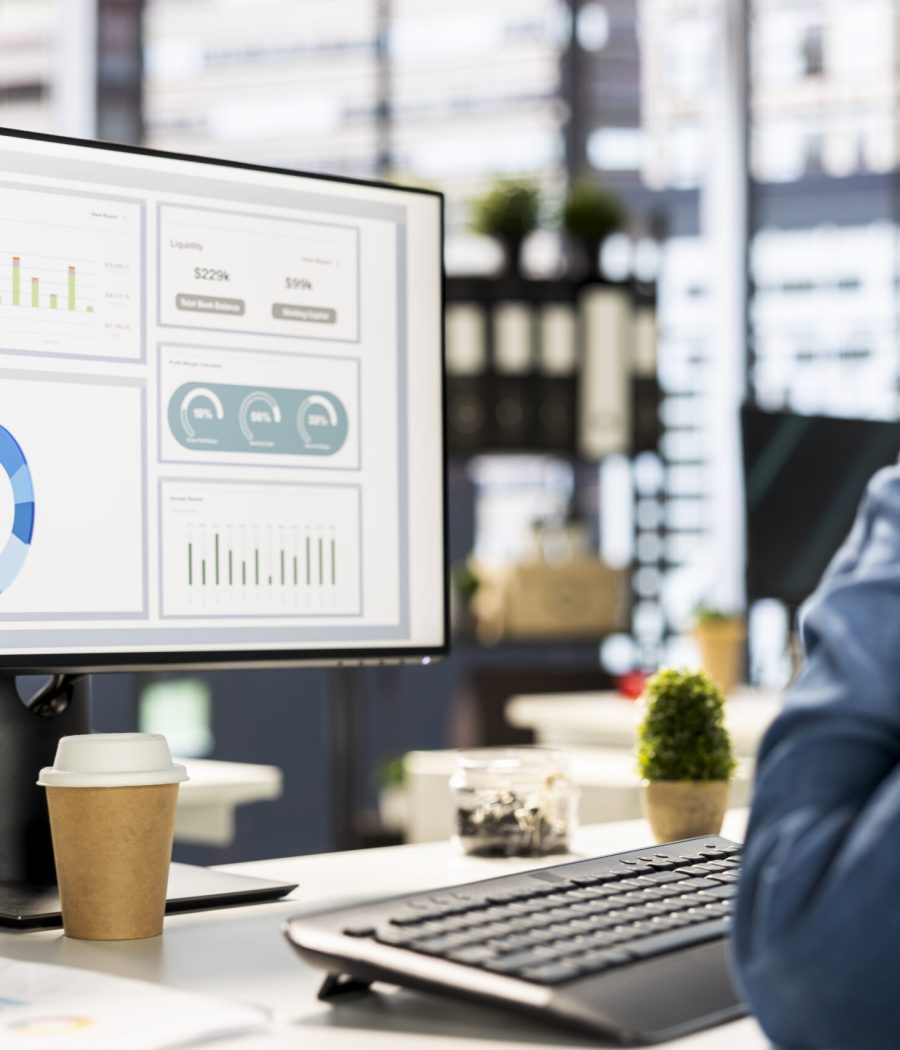 Businessman studying infographics and performance metrics for decision making, focused on project goals. Executive assistant managing business tasks and reviewing data, showcasing expertise.